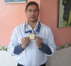 Amit Yogei displaying his gold medal